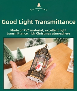 Close-up of vintage bronze Christmas lantern with snowman and swirling snow effect