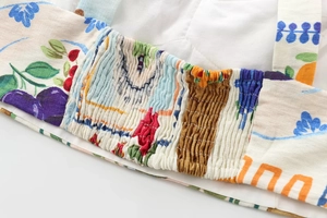 Detail of colorful floral print fabric with elastic smocking design for skirts