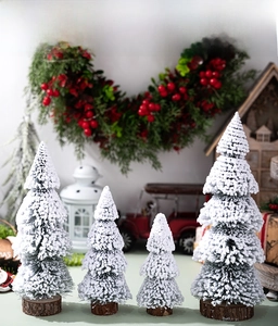 Mini snowy Christmas trees with wooden bases in 4 sizes for festive tabletop decor