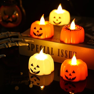 Group of LED pumpkin candle lights with flickering wicks for Halloween party decor