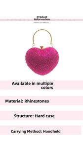 Close-up of heart-shaped rhinestone evening clutch with gold metal handle and hard shell