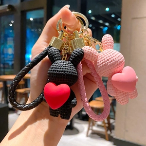 Cute woven-texture rabbit and bear keychains with red hearts in black and pink finishes