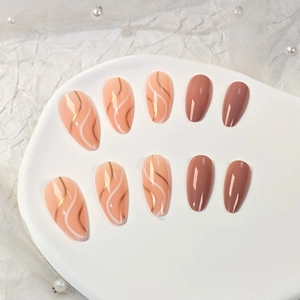 Elegant almond press-on nails set with pink swirl art and dark solid color finish