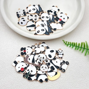 Macro shot of DIY cartoon panda enamel charms with bamboo for jewelry making accessories