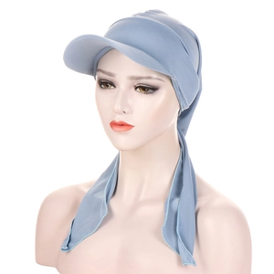 Close-up of Morandi blue turban cap featuring a visor brim and elastic knit texture