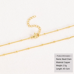 Detail of 18k gold plated copper beaded satellite chain with lobster clasp and extender