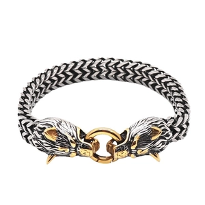 Two-tone stainless steel braided chain bracelet with detailed silver and gold dragon heads