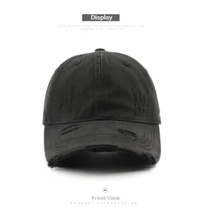 Detailed front view of black distressed cotton baseball cap with vintage worn-out texture