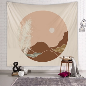 Detail of bohemian sun and mountain tapestry on white brick wall with earthy tones