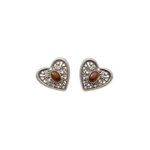 Vintage silver hollow heart earrings with brown zircon center on a clean white background
