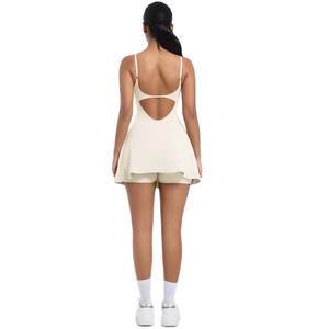 Back view of apricot backless tennis dress with thin straps and built-in shorts