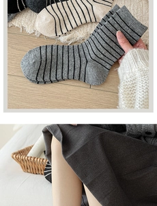 Close-up of wool-blend striped mid-tube socks showing thick knit texture and warm material