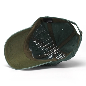 Dark green washed cotton baseball cap with You Are On Native Land embroidery and inner lining