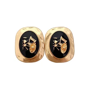 Vintage gold carriage earrings with black enamel inlay in a classic rectangular design