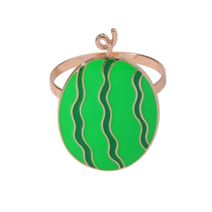 Golden napkin ring featuring a vibrant green enamel watermelon design on a white background