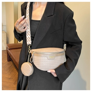 Detail of beige woven belt bag with gold hardware and small round detachable pouch