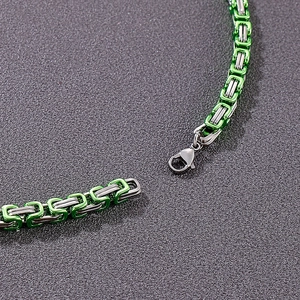 Detail of 5mm green and silver stainless steel Byzantine chain with lobster clasp