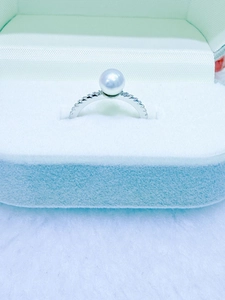 Detailed view of 6-7mm round pearl ring in sterling silver with pave cubic zirconia accents