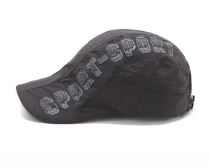 Close-up of breathable mesh fabric and sport-style letter print on the grey cap
