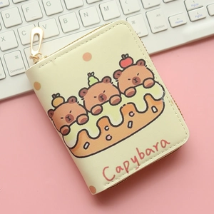 Close-up of beige PU leather capybara wallet with cute cartoon prints and gold zipper
