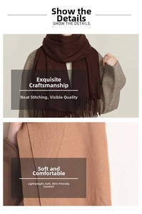 Close-up of soft cashmere-like scarves in dark brown and camel with elegant long fringe