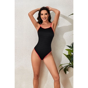 Slim fit black one-piece swimsuit with pink trim and textured fabric for women