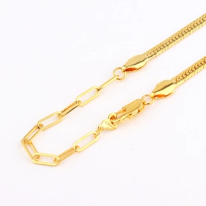 Close-up of 18k gold plated herringbone and paperclip link chain with lobster clasp
