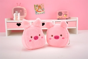 Detail of pink plush pig coin purses with metal zippers and cute creative ornaments