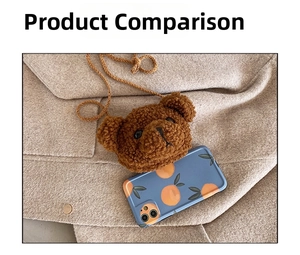 Detail view of mini brown plush bear crossbody bag shown next to a smartphone for size reference