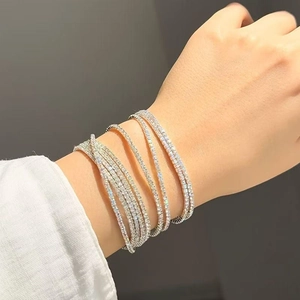 Macro shot of layered crystal stretch bracelets with sparkling clear zirconia stones