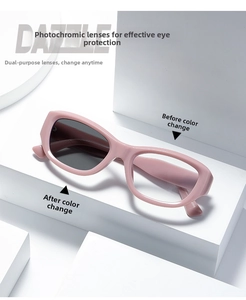 Pink cat-eye glasses showing photochromic lens transition from clear to dark grey