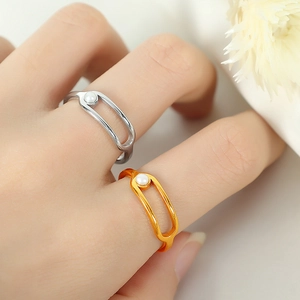 Minimalist French style geometric gold and silver rings with pearls in an oval design