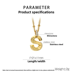 Macro shot of gold stainless steel letter S pendant with sparkling rhinestone details