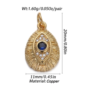 Detail of gold evil eye pendant with blue gemstone and zircon including size measurements