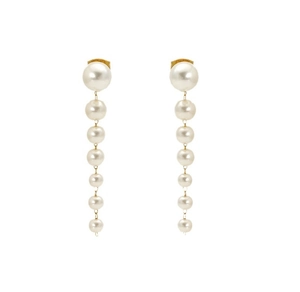 Detail view of long pearl tassel earrings with cascading pearls and gold metal links
