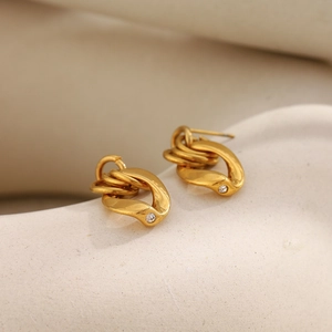 Macro shot of 18K gold plated chain earrings with sparkling cubic zirconia accents