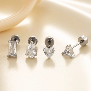 Set of four silver stainless steel screw back earrings with clear zircon stones