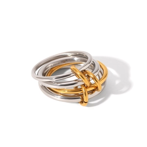Detail of interlocking multi-ring design in mixed gold and silver tones with polished finish