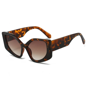 Fashionable oversized tortoise shell cat-eye sunglasses with gradient brown lenses for women
