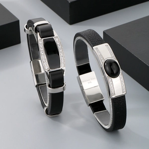 Detail of 316L stainless steel leather bracelets with black stones and sparkling rhinestones