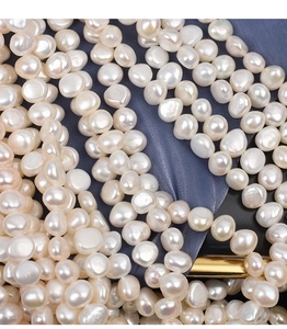 Macro shot of 9-10mm baroque freshwater pearls with high luster and natural textures