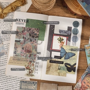 Macro shot of vintage scrapbooking material with butterflies, angels, and floral motifs