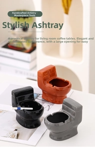 Ceramic toilet-shaped ashtray with wide opening for easy cleaning and ash disposal