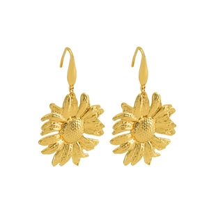 Detail of sunflower gold earrings with hammered texture finish and earring hooks