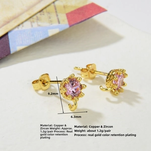 Macro detail of gold plated crown earring studs with pink zircon and dimension specs