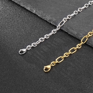 Detail of silver and gold stainless steel link chains with secure lobster clasps