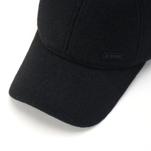 Close-up of winter baseball cap with thick knit texture and sport logo detail