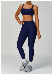Detail of ribbed dark blue yoga set featuring a square neck bra and high waist leggings