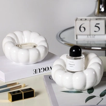 Close-up of white ceramic flower tray set used as jewelry and perfume organizer