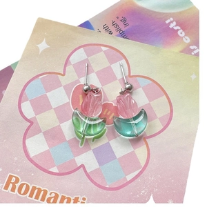 Pink and green tulip flower glass earrings on a pastel checkered floral card display